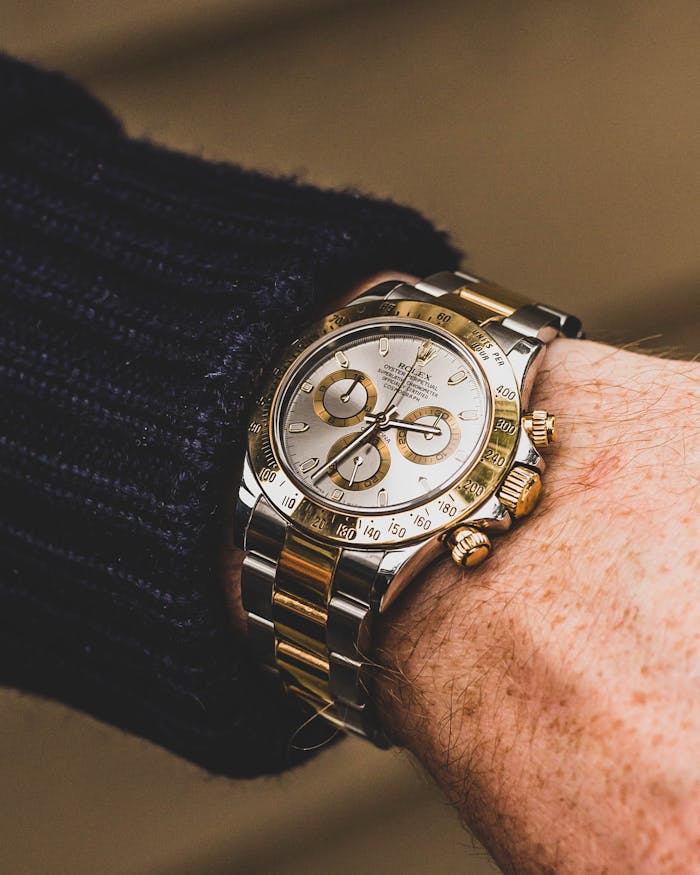 Mastering the First Impression: Your intriguing post title goes here Close-up of a luxury wristwatch with gold and silver details, highlighting time precision.
